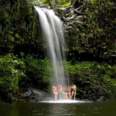 Guests under waterfall on a 5-hour East Maui waterfall hike.