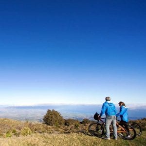 Couple enjoying the view during a bike tour with Haleakala Bike Company.