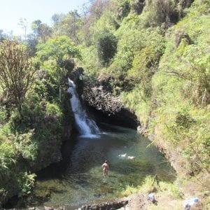 A beautiful waterfall stops on the Road to Hana guided tour on Maui.