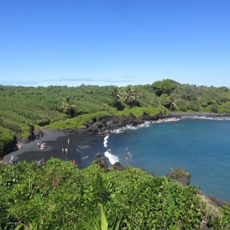 A picturesque black sand beach you will see on your Road to Hana trip on Maui.