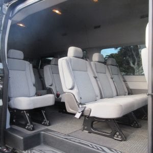 Inside of custom comfort van designed to accommodate up to 14 guests.