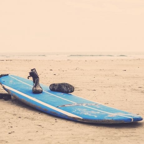 Hang Loose Surf Club surf board on the beach