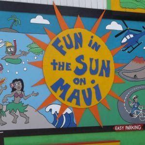 A lively mural with phrase "Fun in the sun on Maui".