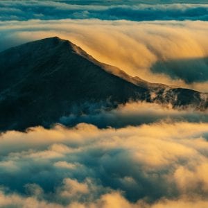 Mesmerizing Haleakala sunset view from above during Maui helicopter tour.