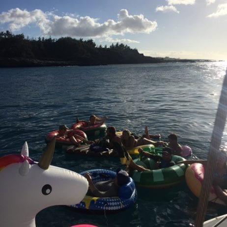 Innertube fun at sunset off Maui