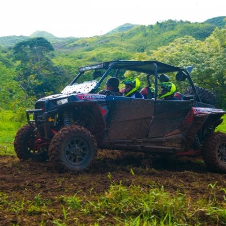 Maui off-road adventures taking guests on a tour in off-road vehicle.