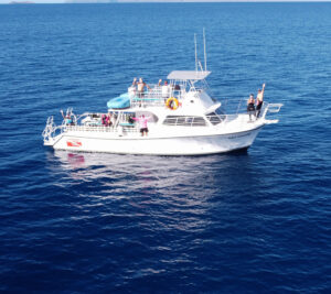 Scuba divers on the Maui Diamond dive boat